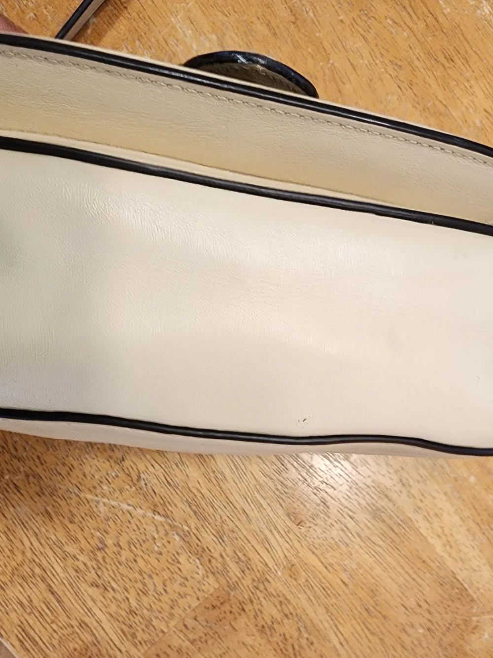 2021 Ivory Coach Beat saddle bag is crafted from glovetanned leather and brass